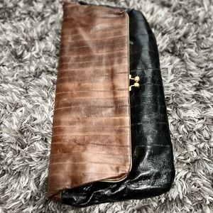 Devi Kroell fold over eel skin clutch.